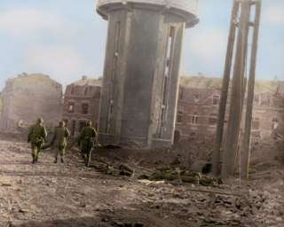 101st Airborne Division walking past dead comrades in Bastogne 