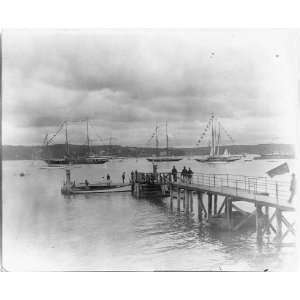  Island Yacht Club looking past pier to sailing yachts at anchor 1905