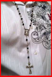 This picture is to illustrate a similar rosary being worn. You are 