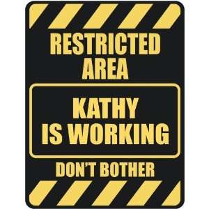     RESTRICTED AREA KATHY IS WORKING  PARKING SIGN