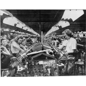  Women working on assembly line of Capehart television sets 