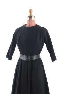 Beautiful late 1950s rich black wool dress. 100% wool, dress has 3/4 