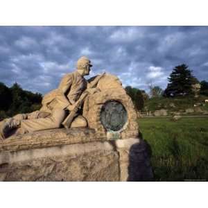 Statue of a Soldier Kneeling against a Wall with His Rifle Stretched 