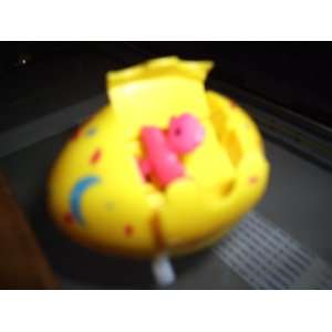 EASTER EGG WIND UP TOY. CHICK POPS OUT OF TOP OPENING OF THE EGG. PINK 