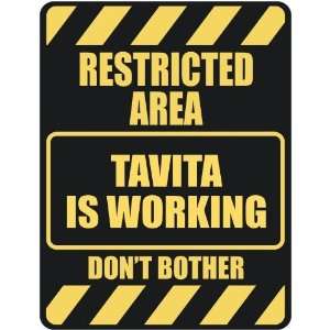   RESTRICTED AREA TAVITA IS WORKING  PARKING SIGN