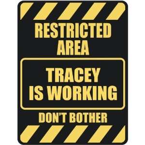   RESTRICTED AREA TRACEY IS WORKING  PARKING SIGN