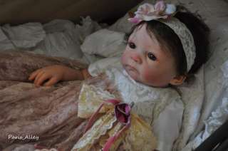 This auction is for the dress and headband only, the doll is my model