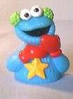 sesame street cookie monster finger puppet with ear muffs and