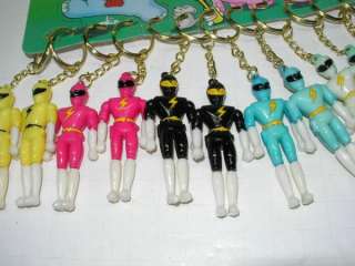 12 RARE VINTAGE POWER RANGERS KEY CHAINS ON A STORE DISPLAY  
