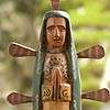 carved by hand from pinewood the beautiful virgin of guadalupe stands 