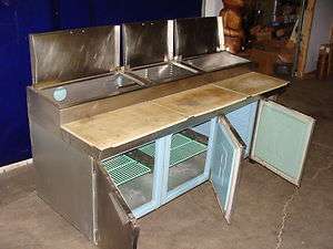    HEAVY DUTY STAINLESS STEEL PIZZA PREP TABLE WITH 85 CUT SURFACE