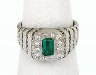 this is a trendy 14k gold diamonds and emerald solitaire band