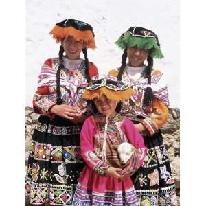 Portrait of Three Local Peruvian Girls in Traditional Dress, Looking 